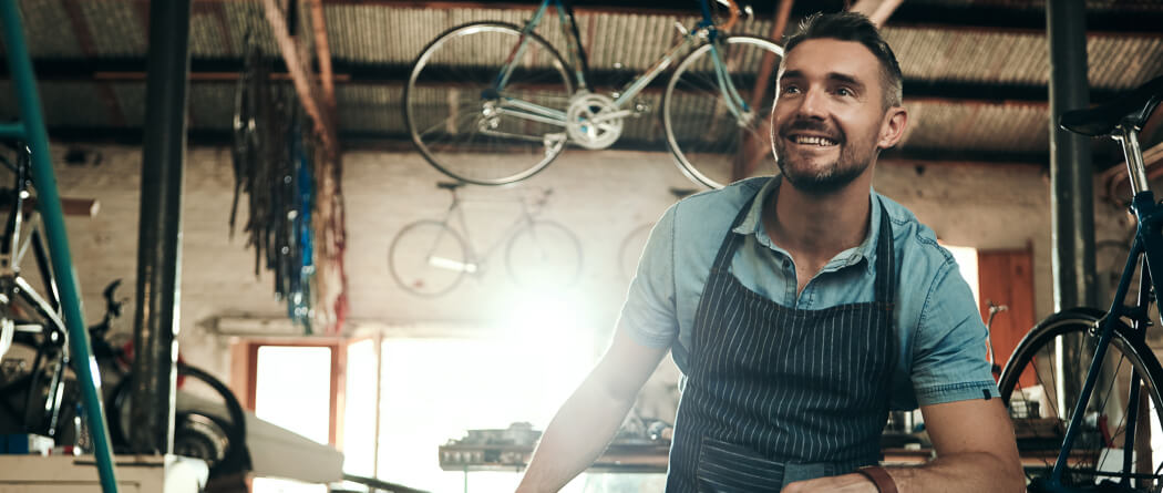 a man in his bicycle shop