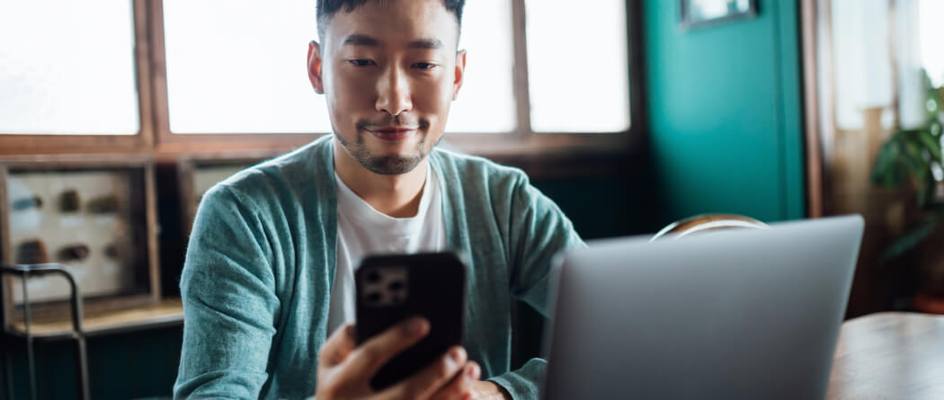 man looking at his mobile device