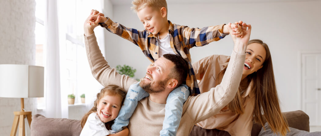 a family playing in their new home